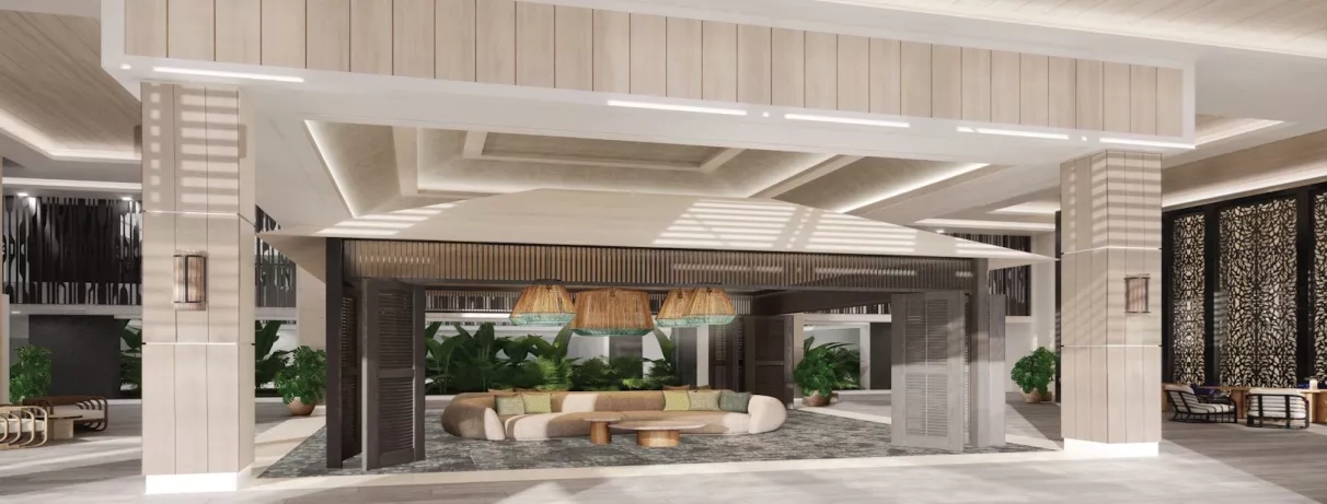 Réception, grand canapé et petites tables basses, plantes vertes