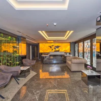 hall d'entrée avec comptoir de réception et fauteuils